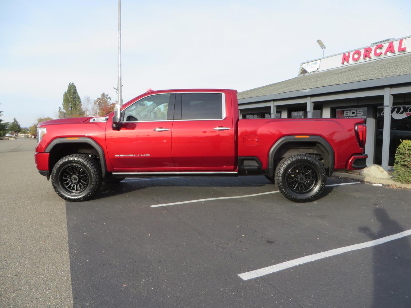 2021 MAROON /BLACK GMC Sierra 3500HD Denali (1GT49WEY1MF) with an Duramax 6.6L Turbo Diesel engine, 10 speed transmission, located at 2630 Grass Valley Highway, Auburn, CA, 95603, (530) 508-5100, 38.937893, -121.095482 - Duramax sitting on a BDS level kit with upper control arms and Fox shocks, 20" XD wheels, and 35" Nitto Ridge Grappler tires. - Photo#7